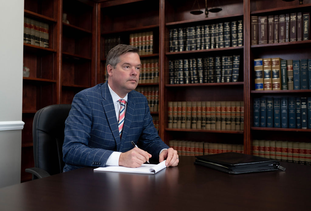 Birmingham family law attorney David Miller of The Harris Firm LLC reviewing paperwork to help an uncontested divorce client